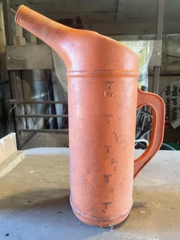 Orange plastic 5L jug with a funnel spout and