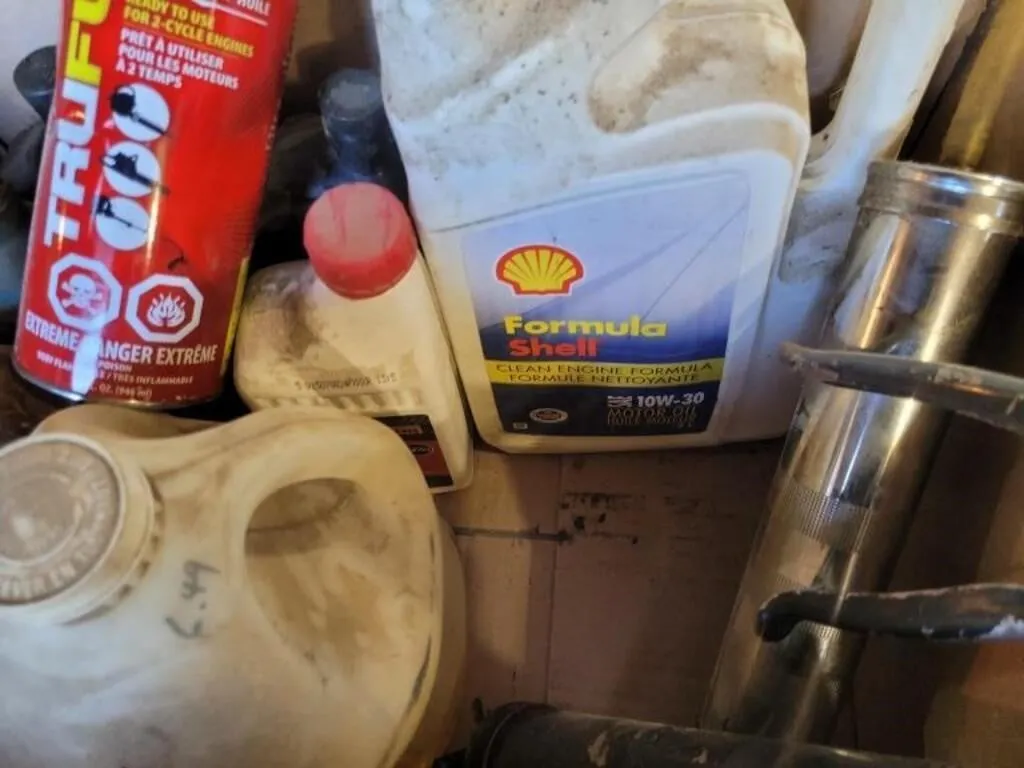 Various Containers of oil ,Grease Gun , Grease