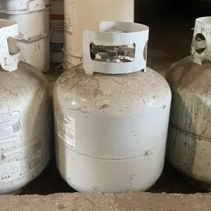 Three 20 lb. expired propane tanks.