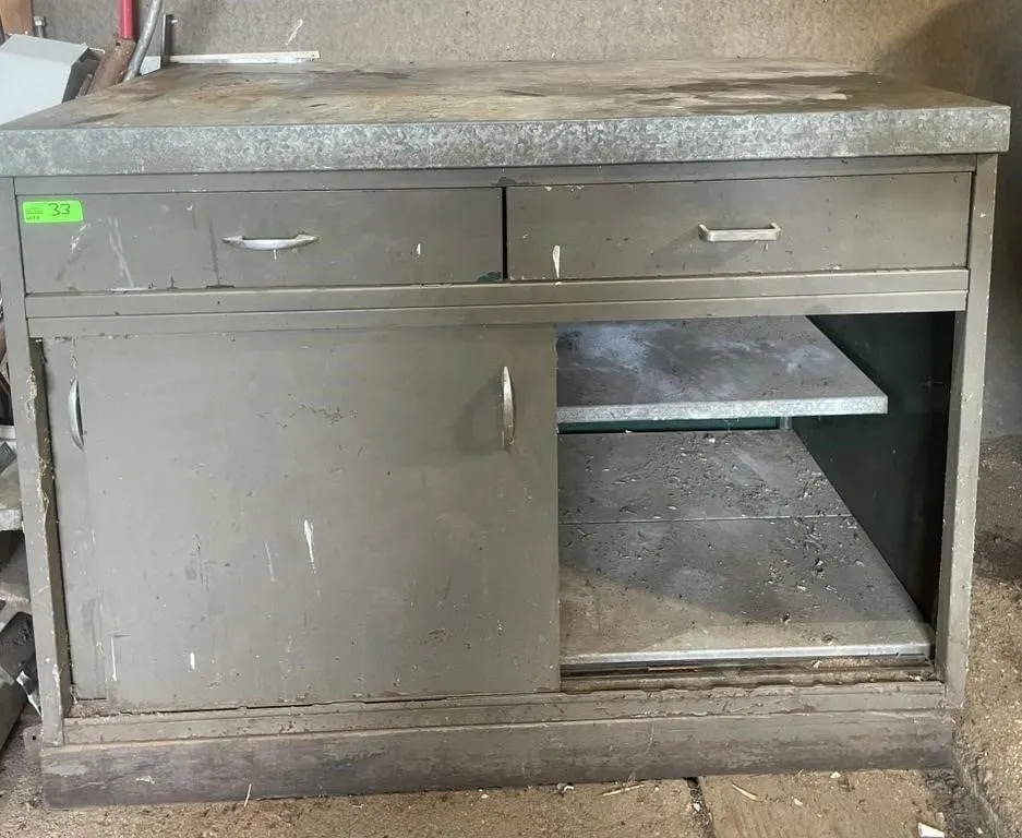 Heavy duty shop cupboard with metal countertop.