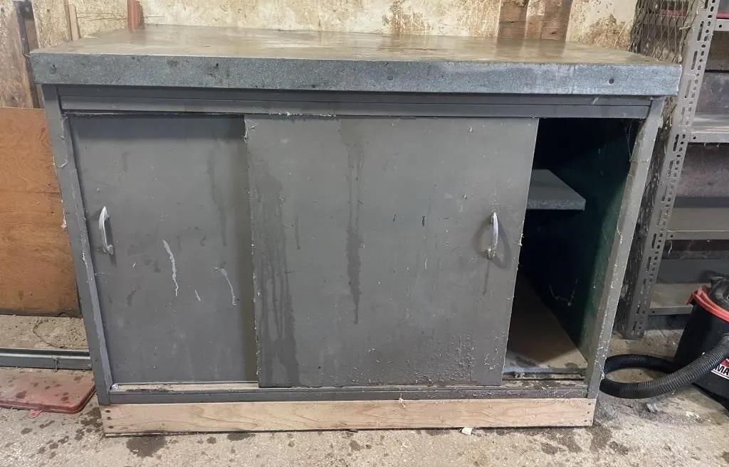 Heavy duty shop cupboard with metal countertop.