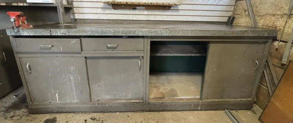 Heavy duty shop cupboard with metal countertop.