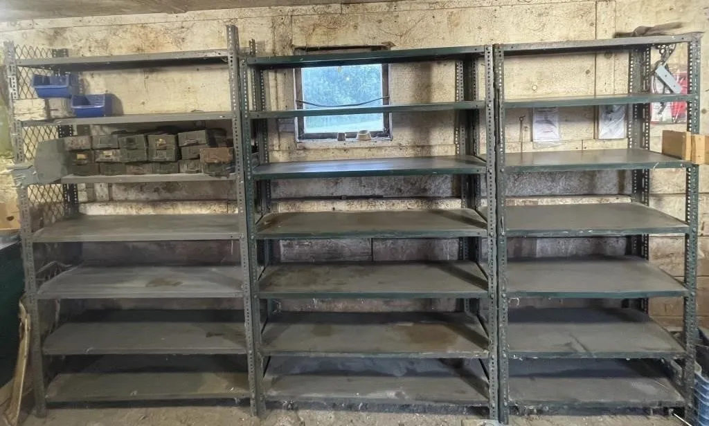 Three multi-tiered industrial storage racks.