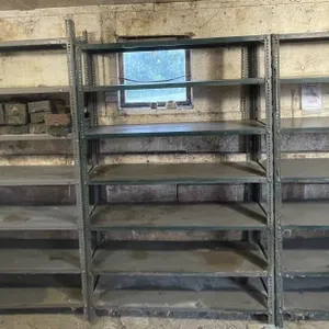 Three multi-tiered industrial storage racks.