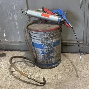 Partial Bucket of Gear Oil with Grease Gun