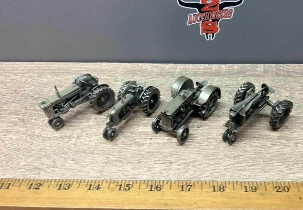 Four 1:64 Pewter Tractors.