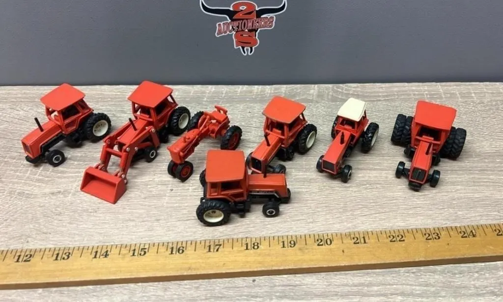 Seven 1:64 Allis Chalmers Tractors.