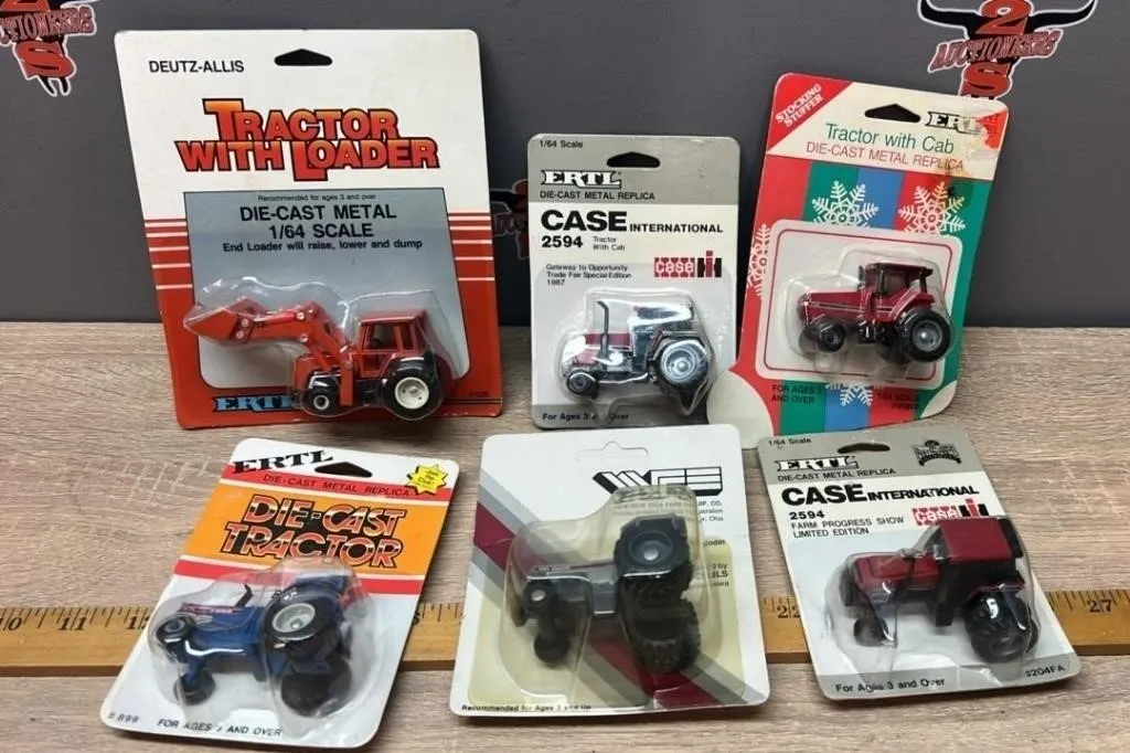 Six Asst. 1:64 Tractors.