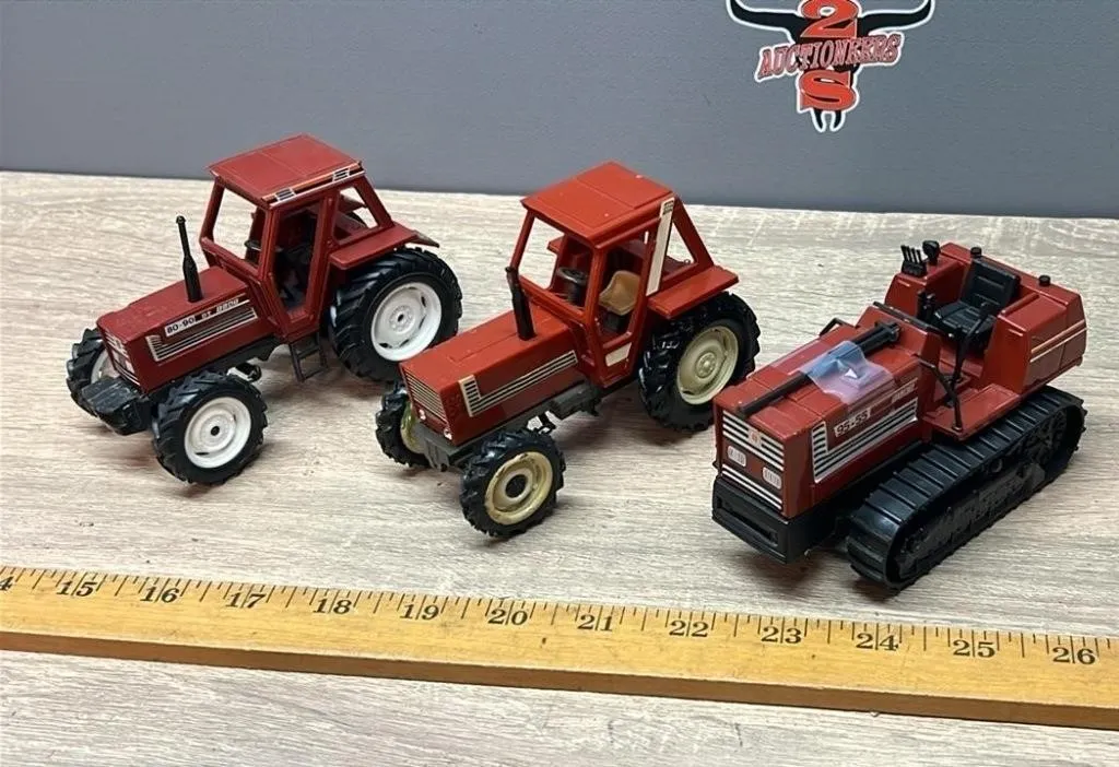 Three 1:32 Fiat Tractors.
