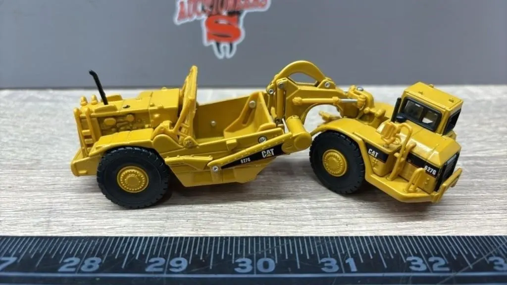 Norscot 1:50 CAT 627G Die Cast Tractor Scraper.