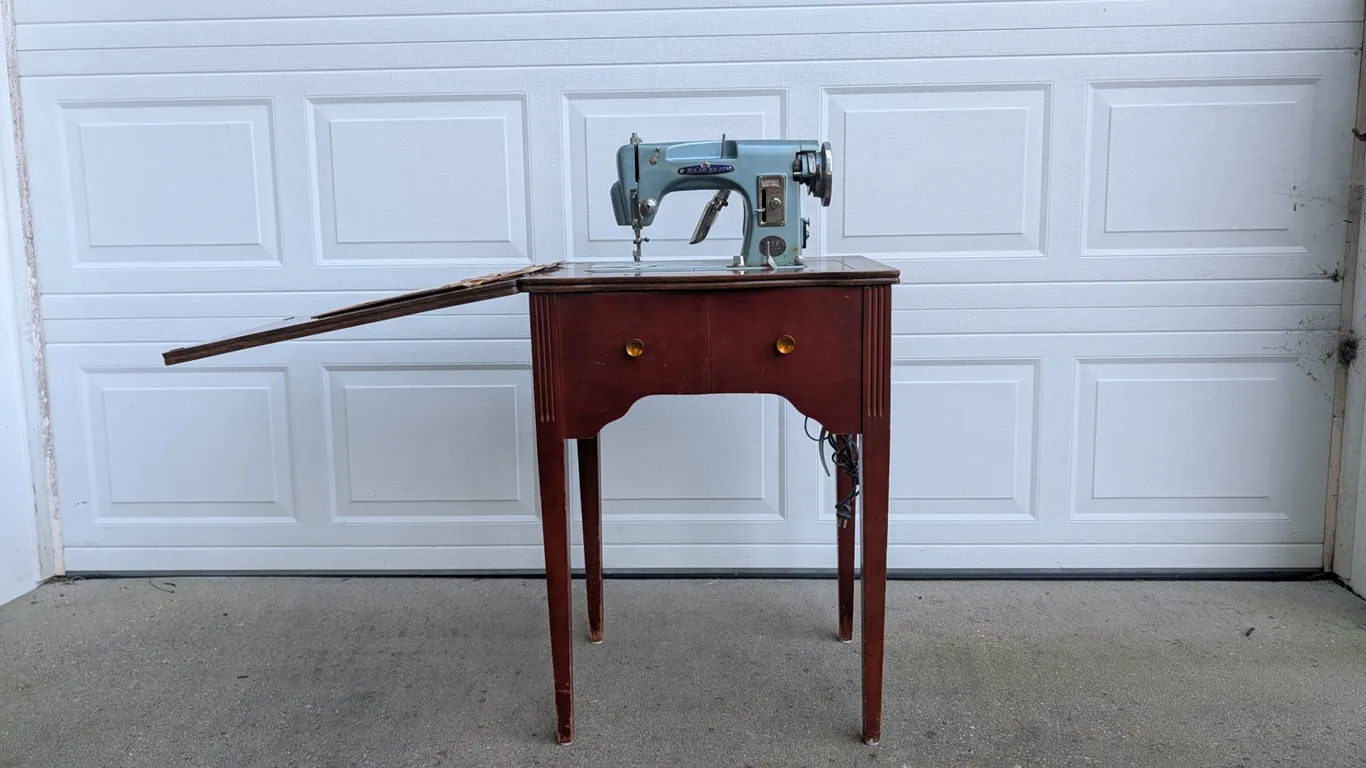 Vintage Household Sewing Machine in Wood Cabinet