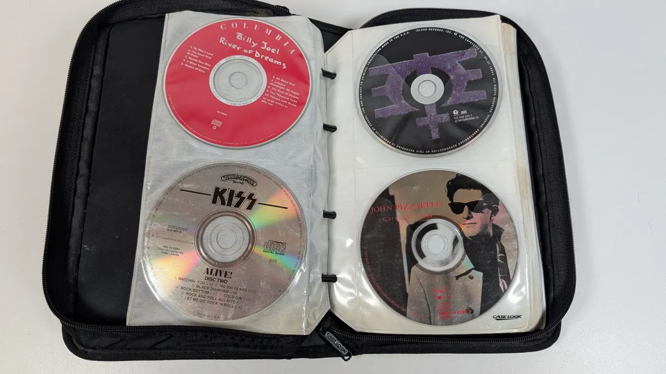 Lot of 17 CDs with Case Logic CD Binder including Billy Joel, KISS, Black Sabbath, Van Halen
