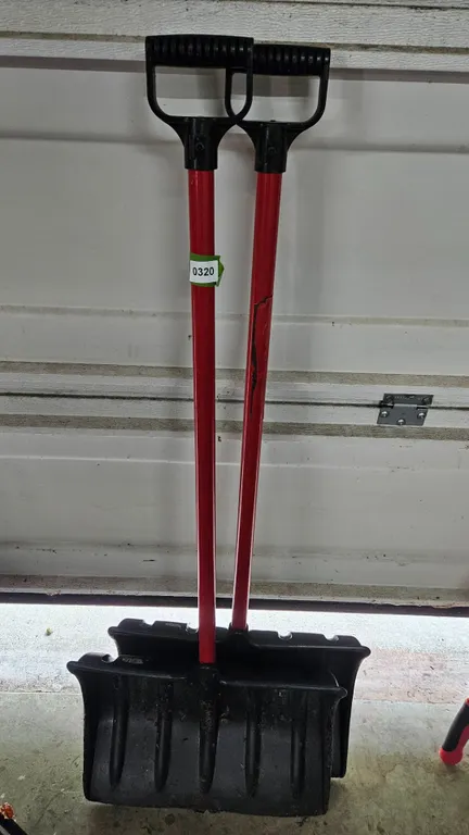 Two Red Handle Black Plastic Snow Shovels