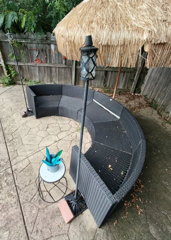 Curved Black Resin Wicker Outdoor Sectional Sofa & Cushions with Tiki Umbrella