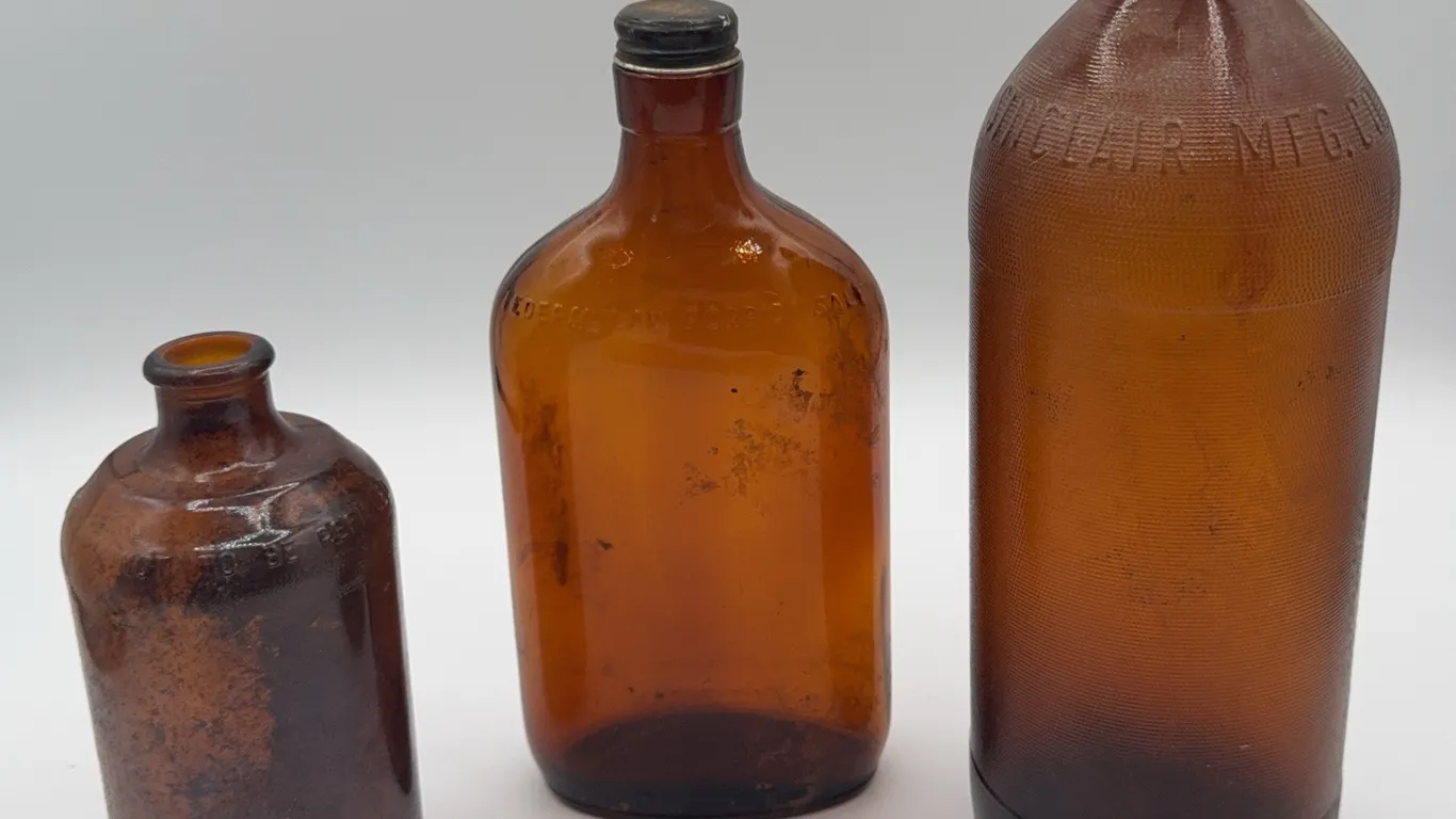 Three Brown Glass Bottles Sinclair Edgar