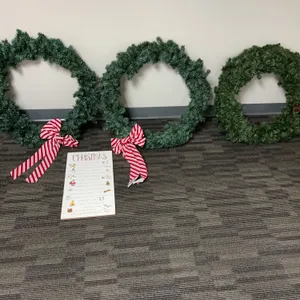 Three Artificial Evergreen Christmas Wreaths with Red & White Bows and Decorative Sign