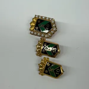 Three vintage S.S. Kresge Company 10k gold Pins
