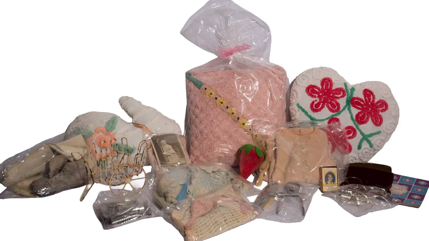CHENILLE PILLOWS, HANDMADE CHILDREN'S CLOTHING, AND METAL HAIR PERM RODS.
