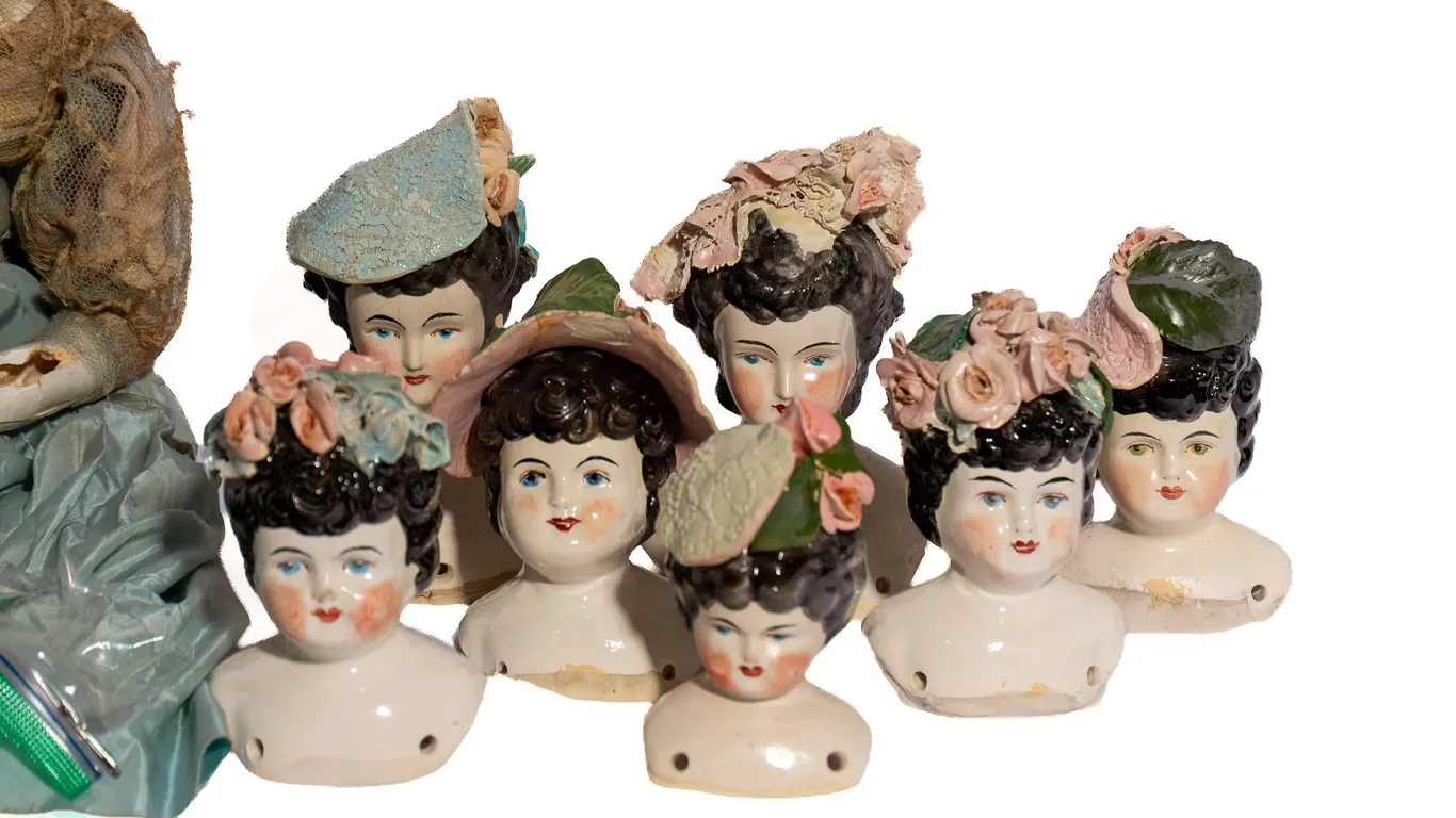 CHINA DOLL HEADS AND HAND CRAFTED DOLL.