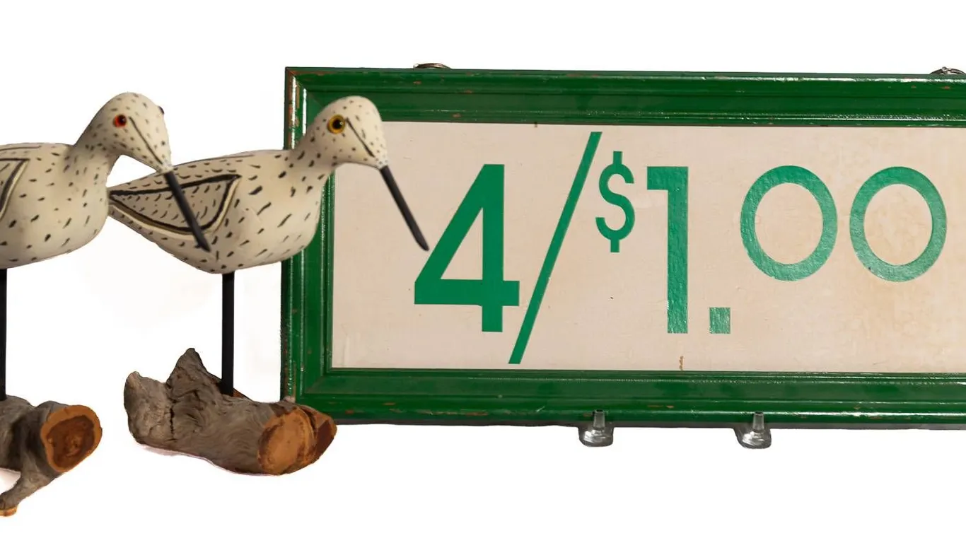 CARVED BIRDS WITH SIGN.