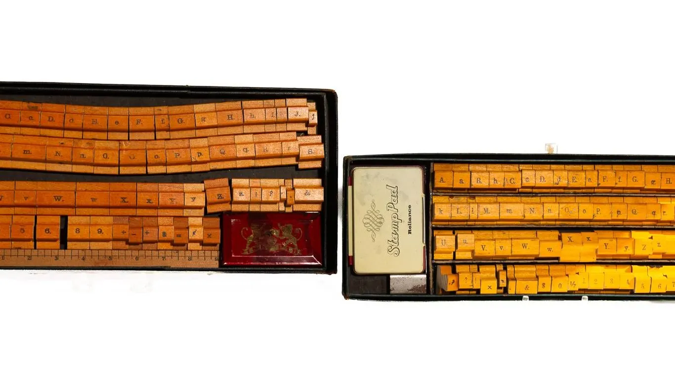 TWO SETS OF WOODEN RUBBER STAMPS.