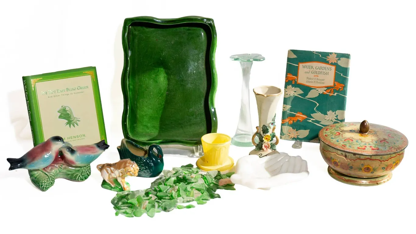 DECORATIVE PIECES INCLUDING VASES, TRAY, AND BOOKS.