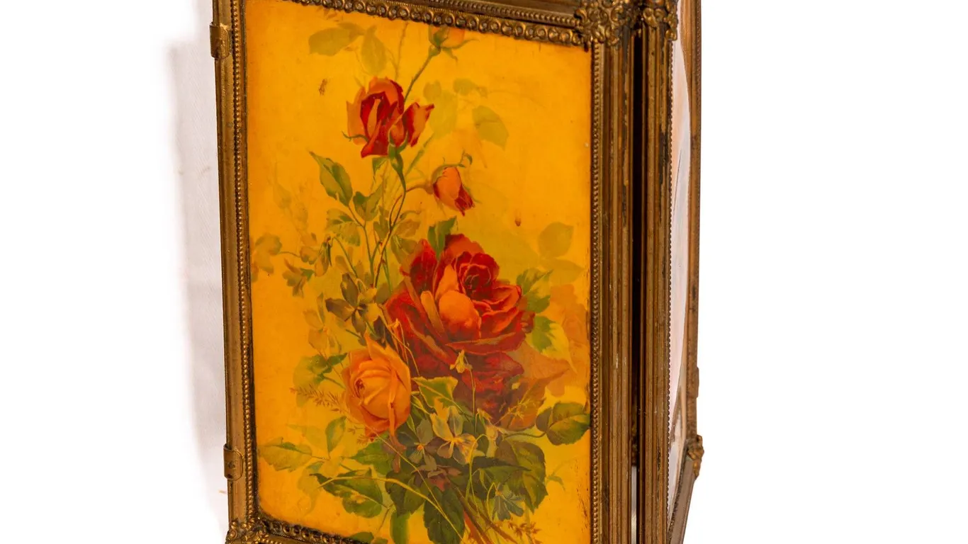 ORNATE GILDED TRI-FOLD VANITY MIRROR WITH BEVELED GLASS.