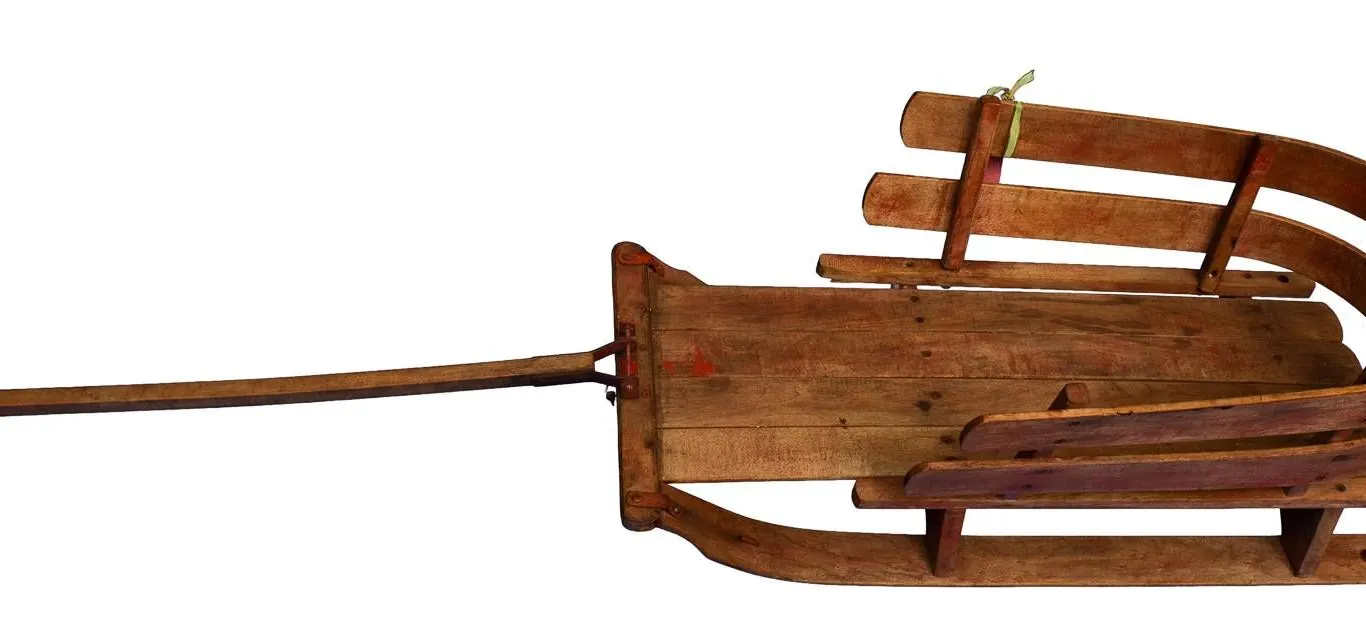 WOODEN CHILD'S SLED WITH CURVED BACK AND PULL HANDLE.