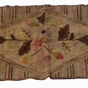 HOOKED RUG WITH FLORAL AND STRIPED PATTERN.