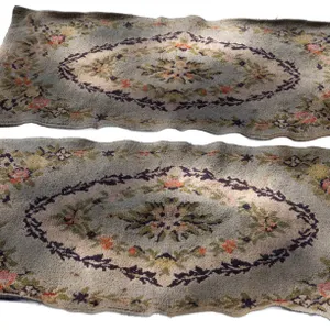 TWO HOOKED RUGS WITH FLORAL MOTIFS.