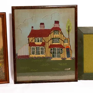 FRAMED PRINT AND EMBROIDERY OF HOUSES.