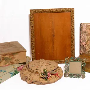 FRAME, BOOKS, SEWING BASKET, AND DECORATIVE BOXES.