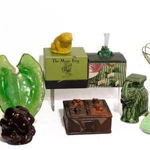 GREEN FRUIT STANDS, FROGS, BUDDHA, AND ELEPHANTS.