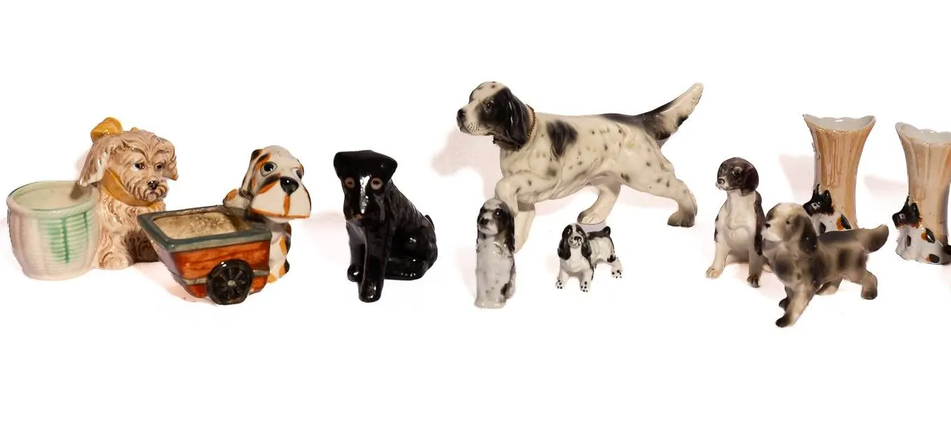 DOG FIGURINES MADE OF CERAMIC AND PORCELAIN.