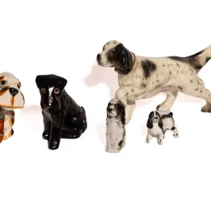 DOG FIGURINES MADE OF CERAMIC AND PORCELAIN.