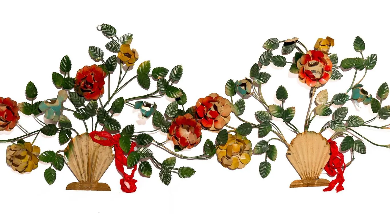 TOLE FLORAL WALL HANGINGS IN SHELL VASE MOTIF.