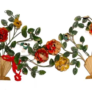 TOLE FLORAL WALL HANGINGS IN SHELL VASE MOTIF.
