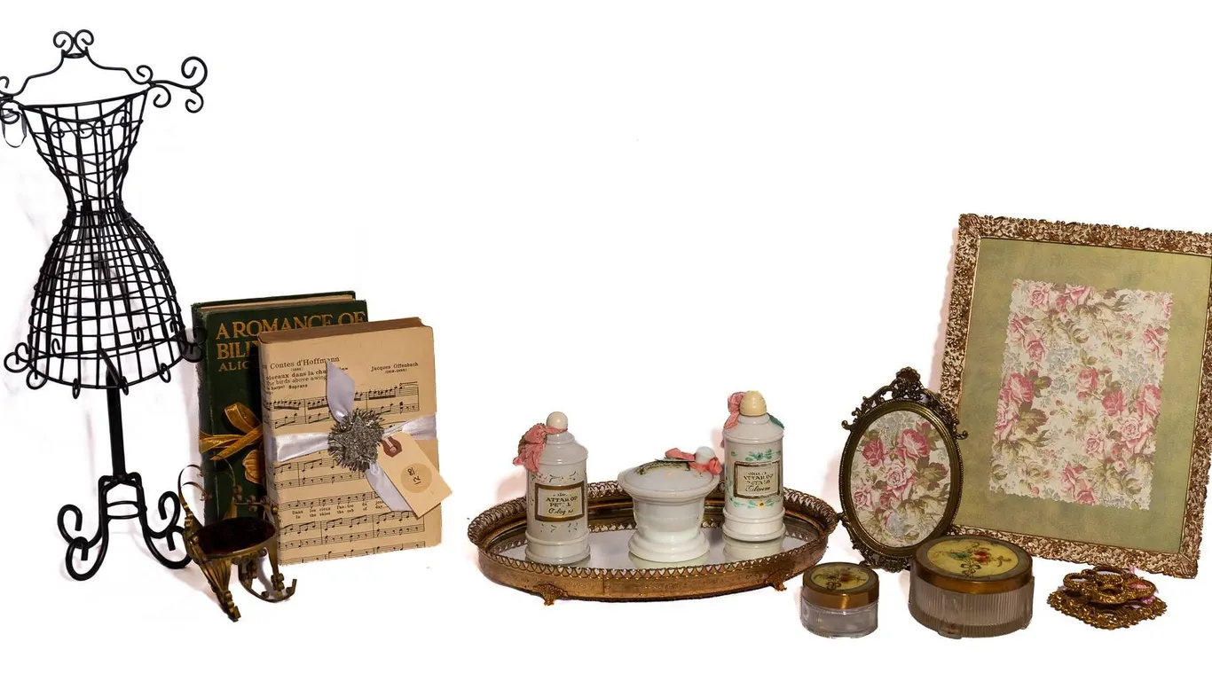 MILK GLASS, BRASS FRAMES, BOOKS, LIPSTICK HOLDER, JEWELRY DISPLAY.