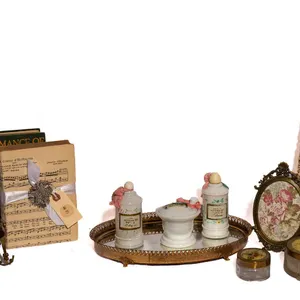 MILK GLASS, BRASS FRAMES, BOOKS, LIPSTICK HOLDER, JEWELRY DISPLAY.