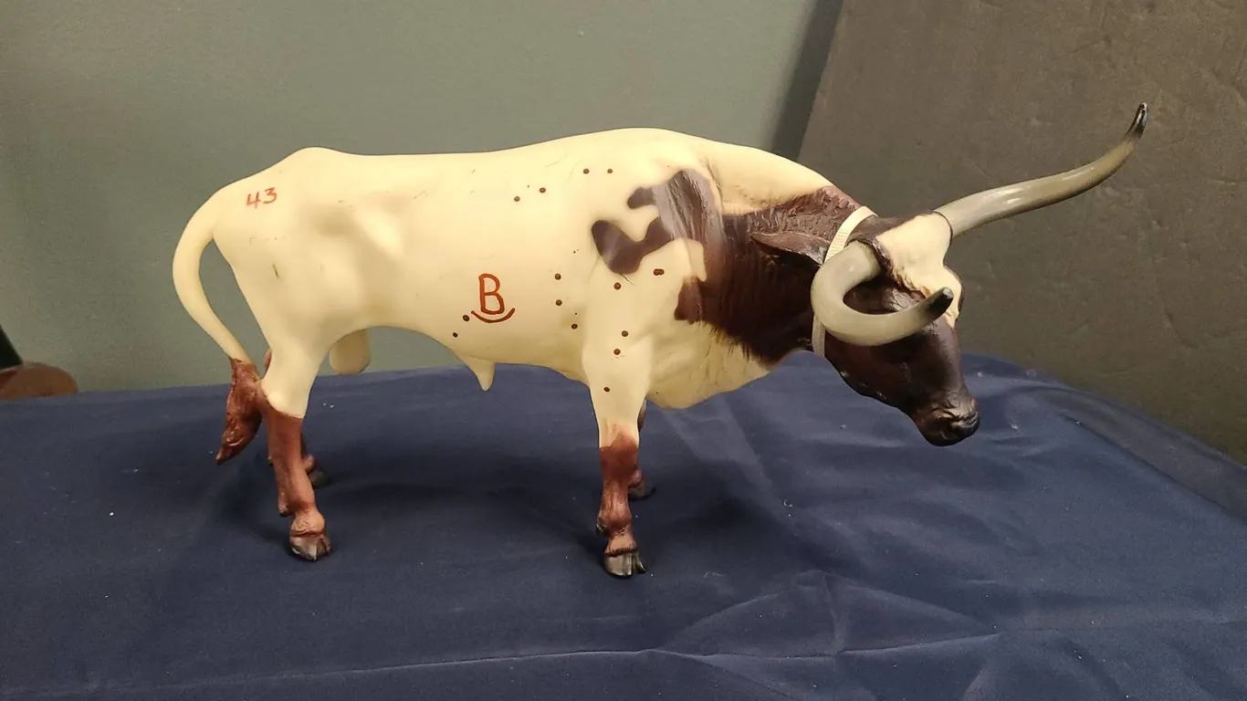 Hand-Painted Longhorn Steer Model Figurine with Distinctive Brown and Cream Markings and Branded Det