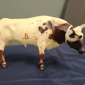 Hand-Painted Longhorn Steer Model Figurine with Distinctive Brown and Cream Markings and Branded Det