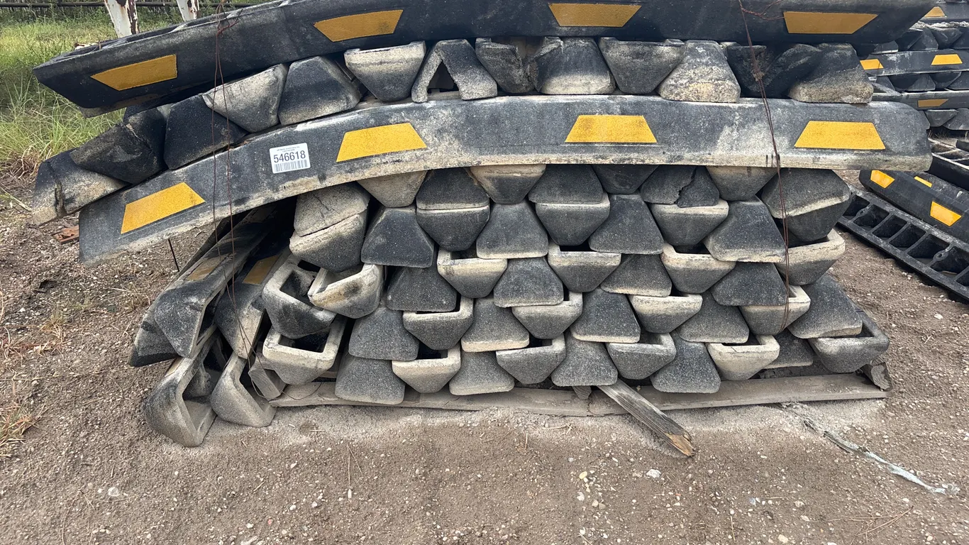 3 PALLETS OF RUBBER PARKING CURBS