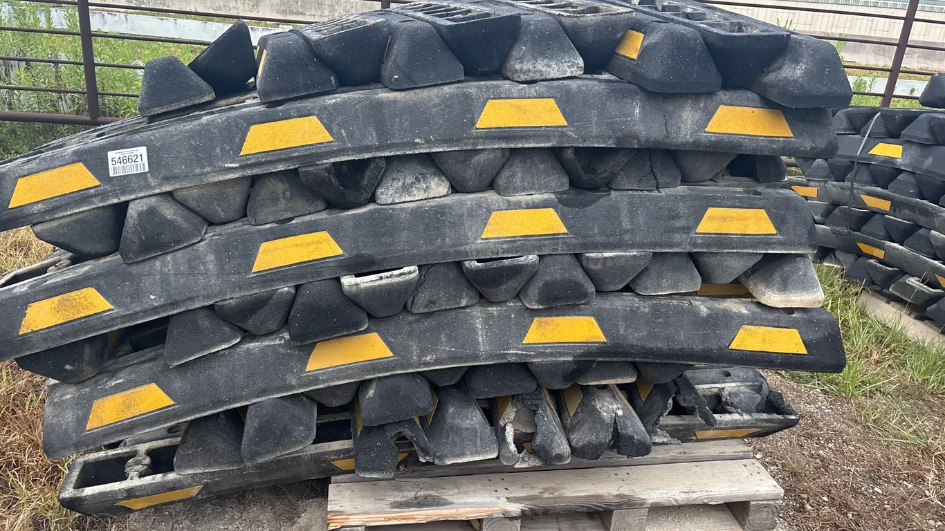 QTY OF RUBBER PARKING CURBS