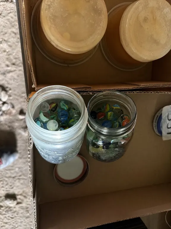 Marbles, two jars sell together