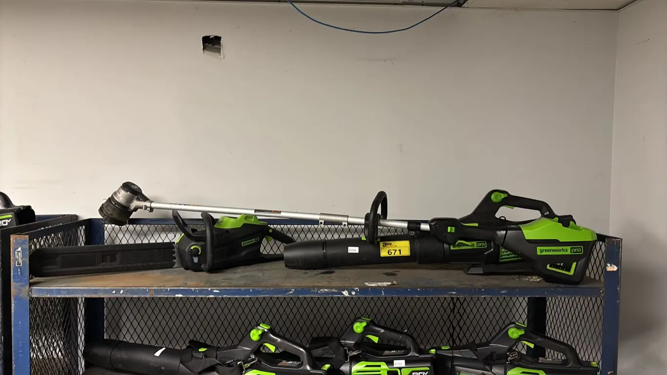 SHELF OF GREENWORK PRO CORDLESS TOOLS TRIMMER, BLOWER AND CHAIN SAW