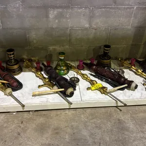 SHELF OF ASSORTED MODERN HOOKAHS WITH BASES AND PIPES