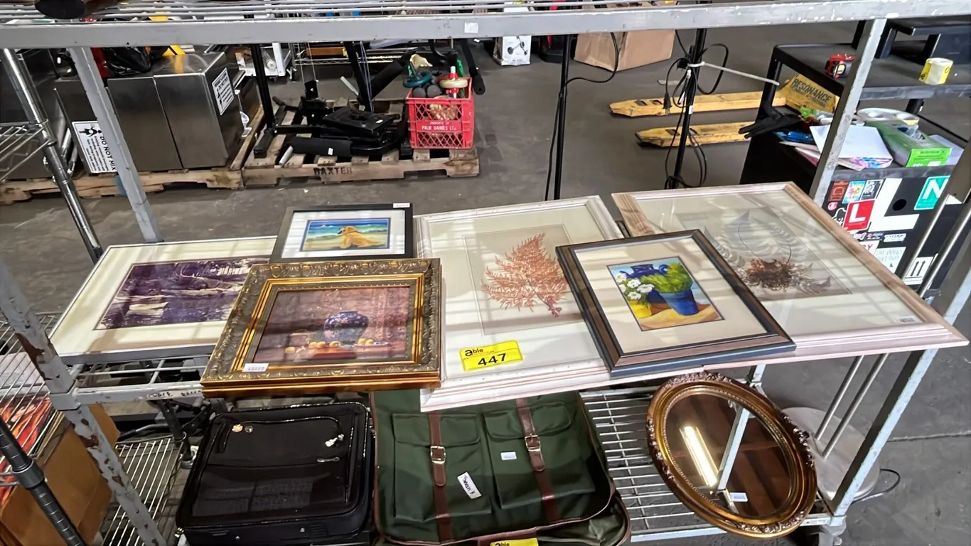 SHELF OF ASSORTED FRAMED ART