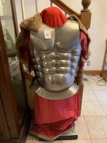A POLISHED, STEEL MEDIEVAL STYLE BREASTPLATE AND