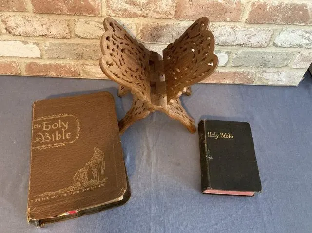 2 VINTAGE BIBLES & A CARVED WOOD STAND