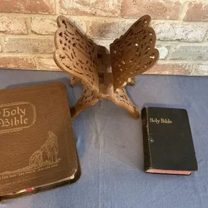 2 VINTAGE BIBLES & A CARVED WOOD STAND
